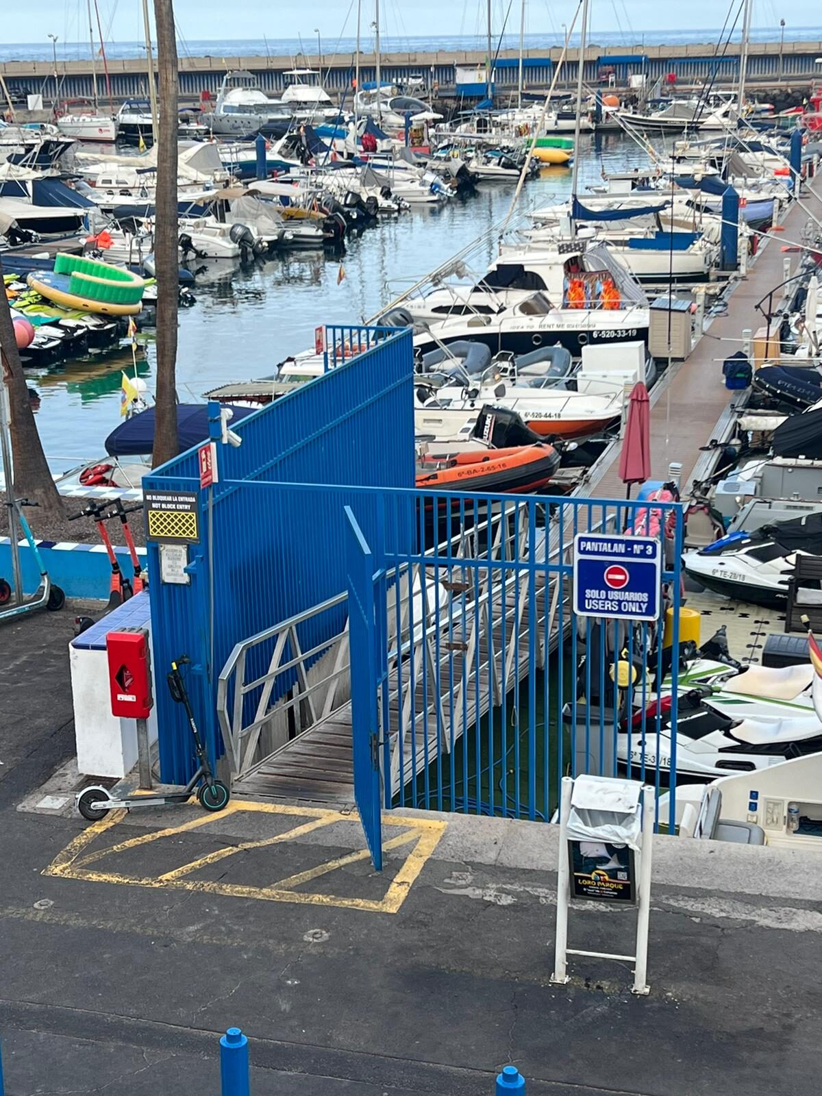 The blue Gate 3 entrance at Puerto Colón marina in Costa Adeje, Tenerife