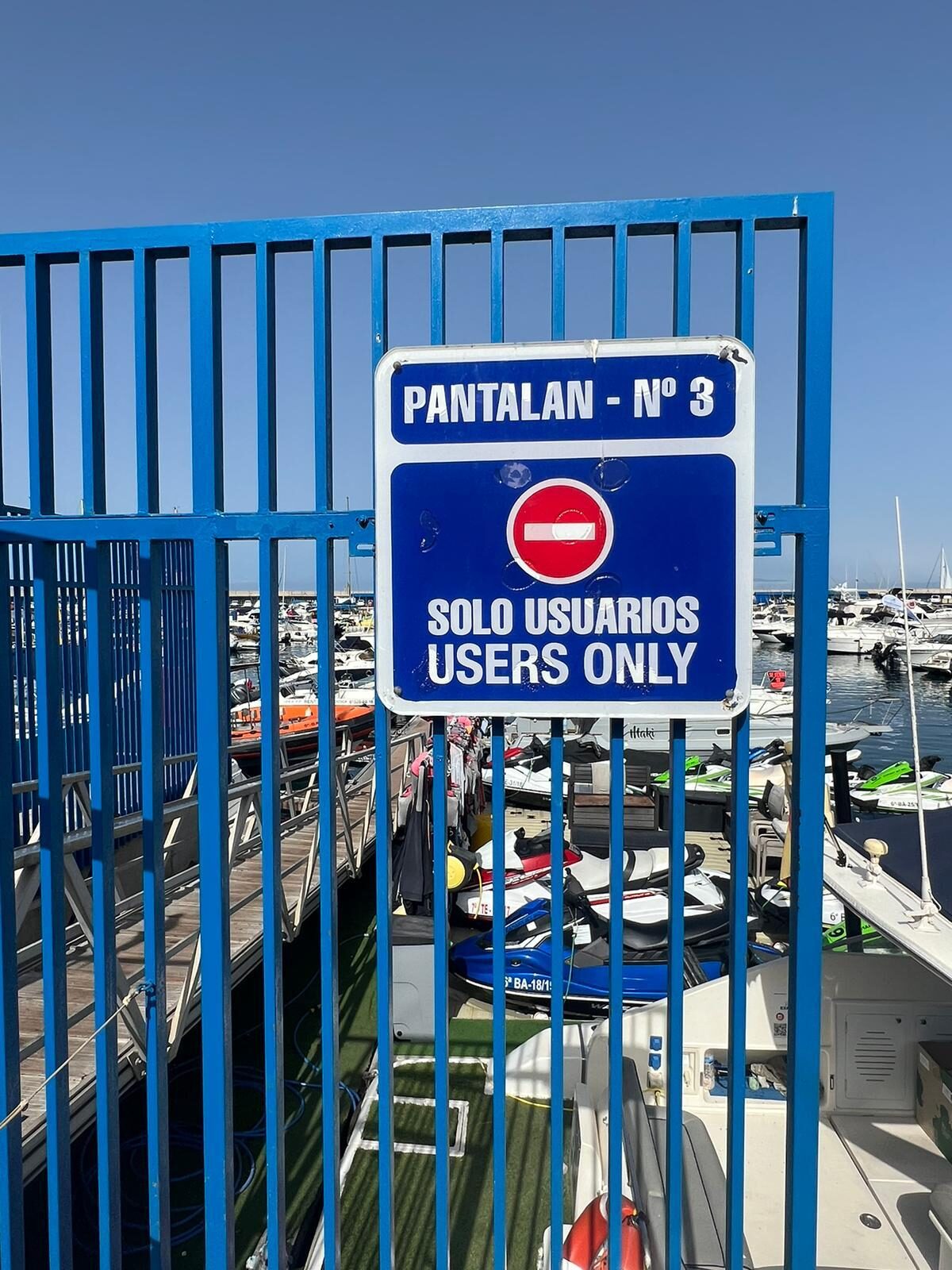 Blue gate at Pantalán 3, Puerto Colón marina, Costa Adeje — the whale watching meeting point