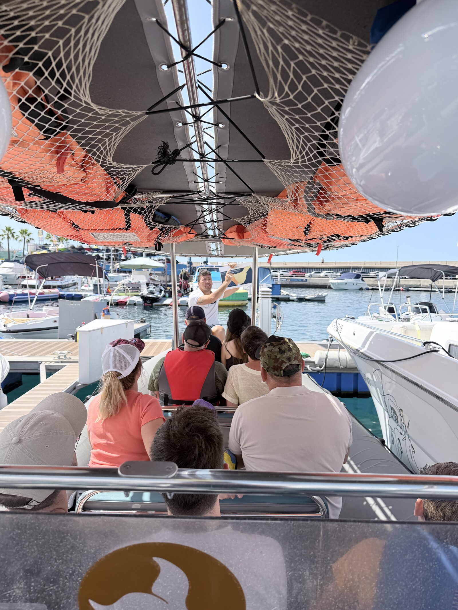 A small group of passengers on a whale watching boat in Tenerife
